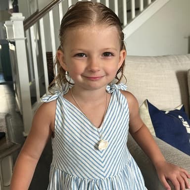 Customer wearing Nora's seashell necklace